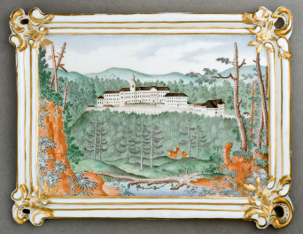 Ein Landschaftsbild mit Schlossabbildung auf Porzellan.