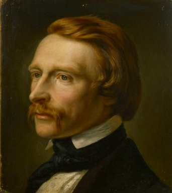 Porträtbild eines Mannes mit roten Haaren und rotem Bart.