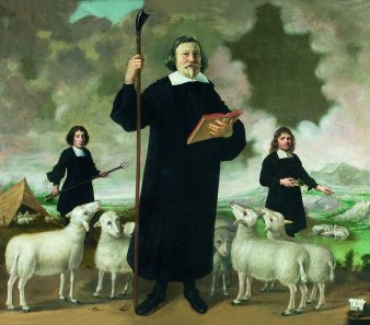 Pfarrer mit Hirtenstab und Schafen.