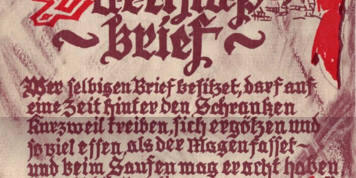 Ein historisch anmutendes Papier mit alter Schrift und aufgedrucktem roten Siegel