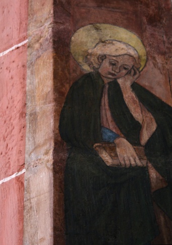 Abbildung eines Menschen mit Heiligenschein und Buch in der Hand.