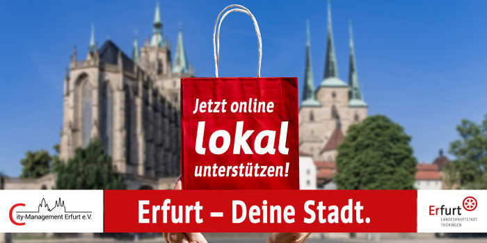 Bild: Jetzt online lokal unterstützen! © Stadtverwaltung Erfurt Verschwommener Dom im Hintergrund mit einem rot-weißen Banner im Vordergrund, auf dem Erfurt – Deine Stadt steht.