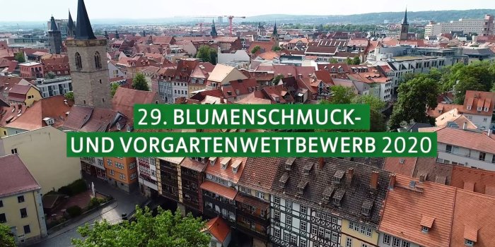 Eine Drohnenaufnahme von der Erfurter Innenstadt mit der Aufschrift "29. Blumenschmuck- und Vorgartenwettbewerb"