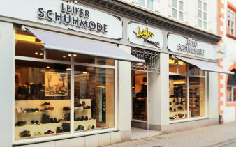 Bild einer Häuserfassade/Ladengeschäft