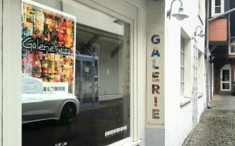 Bild einer Häuserfassade/Ladengeschäft