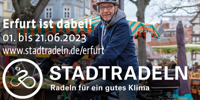 Auf einem Plakat ist ein Mann mit Fahrrad zu sehen sowie die Aufschrift "Stadtradeln" mit weiterem Text. 