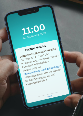 Handy mit Probewarnung