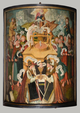 Foto: Hostienmühle: Pfeilerbild im Hohen Dom zu Erfurt St. Marien, Kathedralkirche des Bistums Erfurt, 1534 © Bistum Erfurt, Foto: Falko Behr Allegorische Darstellung der Transsubstantiation (lat.: „Wesensverwandlung“).Am oberen Bildrand Gott, darunter die symbolische Mühle, in die das Korn (Gottes Wort - hier in Form von Spruchbändern)hineingegeben wird. Die Mühle verwandelt es in die Hostie (lat.: hostia "Opfer" oder "Opfergabe"), die nach der Lehre von der Transsubstantiation der Leib Christi, im Bild das Jesuskind, ist. Letzteres sitzt im Kelch, der von den Bischöfen gehalten wird. Angetrieben wird die Hostienmühle von den Aposteln.