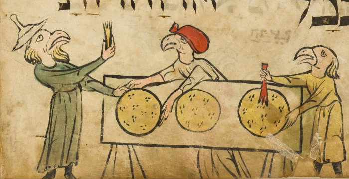 Detail Vogelkopf-Haggada Zu sehen ist ein Detail einer mittelalterlichen Handschrift: Der Seitenrand ist mit einer Szene von an einem Tisch stehenden und sitzenden Menschen verziert. Anstelle menschlicher Köpfe tragen die Figuren jedoch Vogelköpfe, um so das Verbot menschlicher Darstellungen im Judentum zu umgehen. Die Figur ganz links trägt einen Judenhut und ist dadurch eindeutig als Jude zu erkennen.